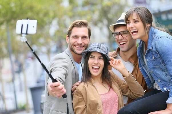 Friends using a selfie stick